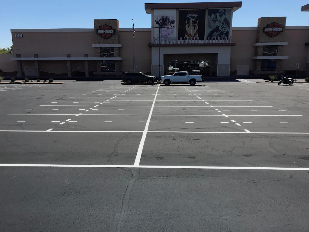 what repairs are essential before sealcoating a parking lot